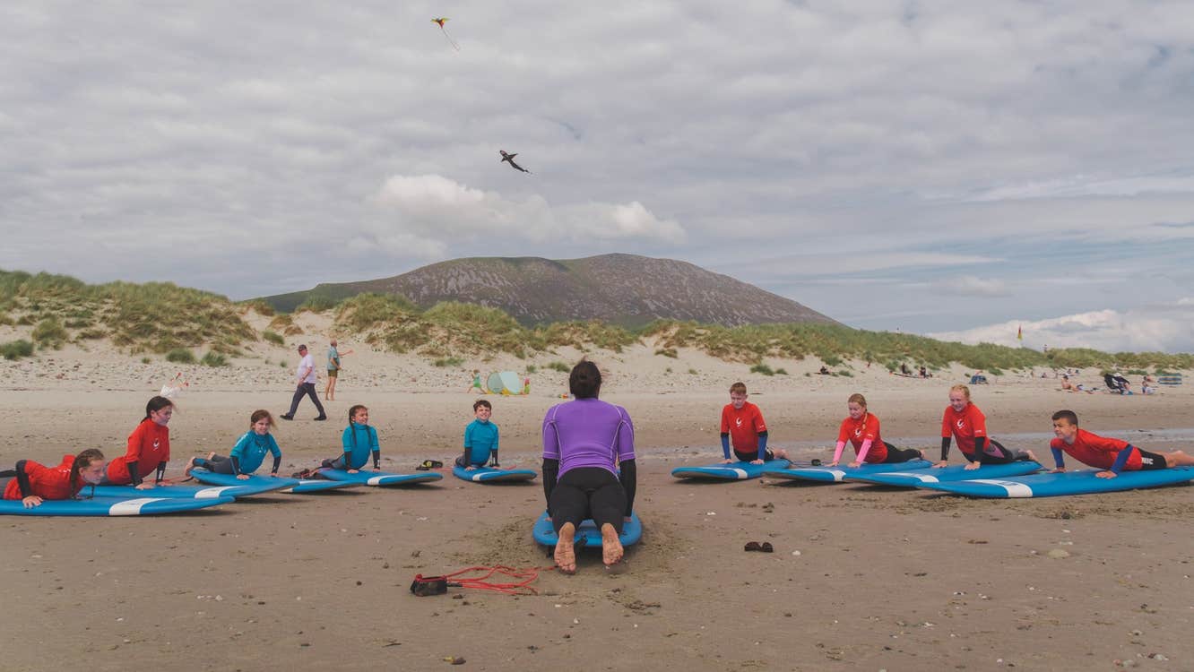 A surfing lesson on the beach with Soundwave Surf School