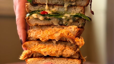 A selection of different toasted sandwiches stacked on top of each other