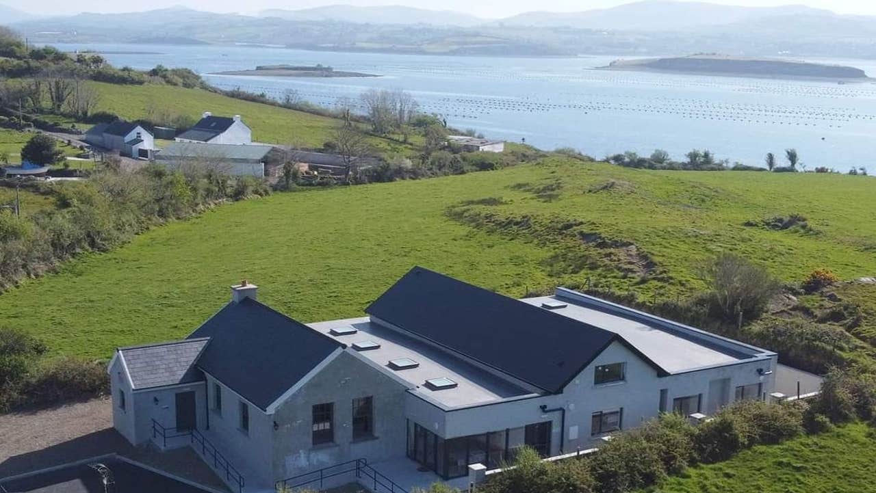 View of property and sea in the background
