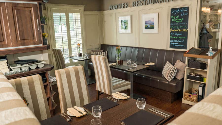 A view of the interior of Poacher Restaurant seating area