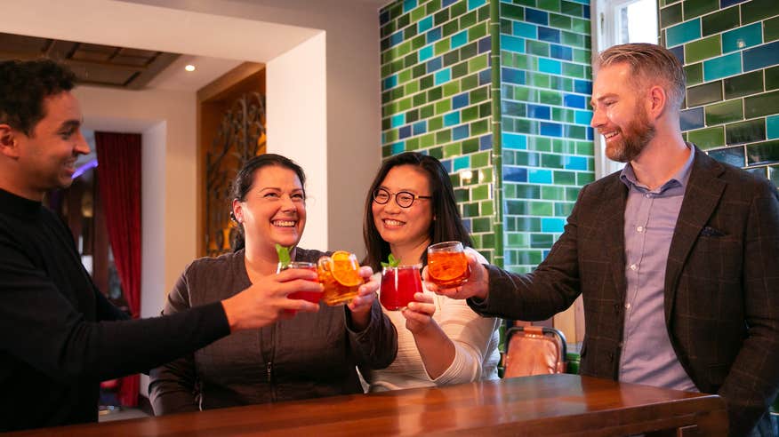 Four people enjoying a drink at the Jameson Distillery in Midleton, County Cork.