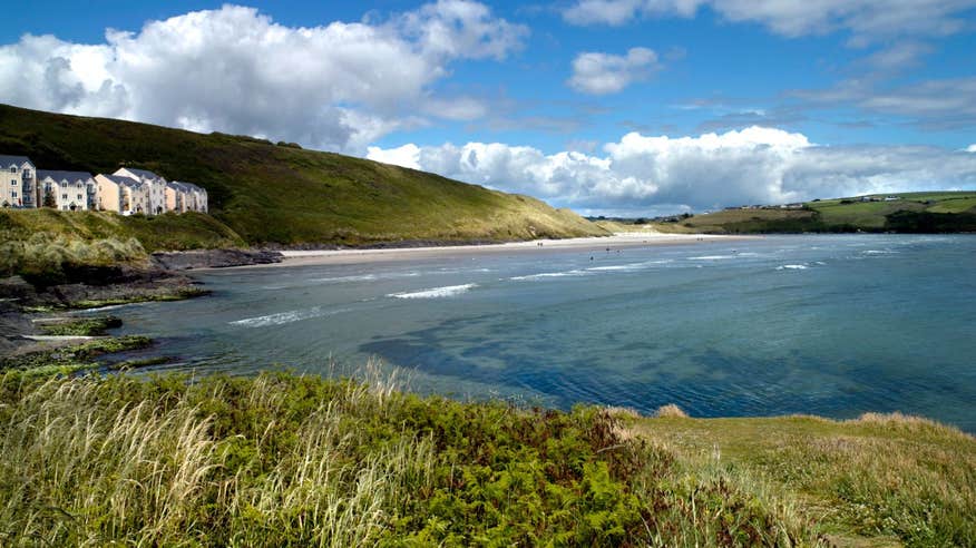 A view of the golden beach and blue waters of Inchydoney Beach