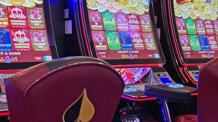 Playland Casino view of chairs in front of colourful digital gaming machines
