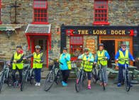 A group of people with Loop Head e bikes outside the Long Dock bar