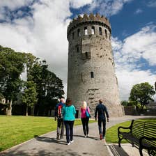 People walking up to Nenagh Castle in County Waterford