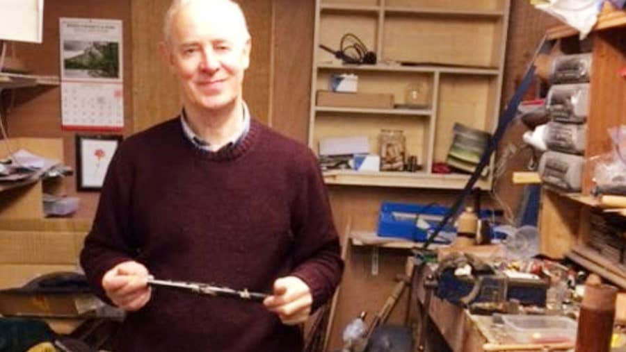 Michael Vignoles standing in his workshop