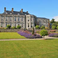 Immaculate lawns and flowerbeds outside Castle Durrow back garden in County Laois