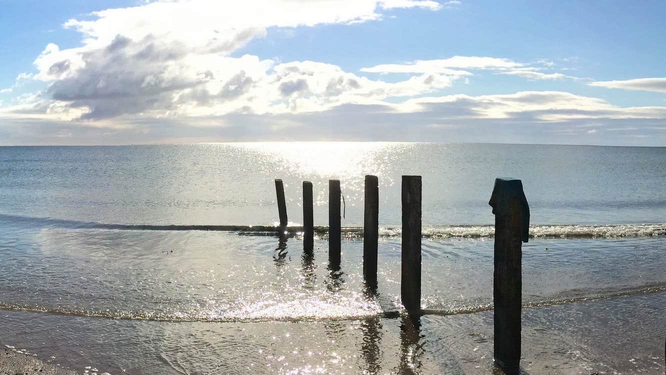 A view of Redbarn Beach in the spring sunshine