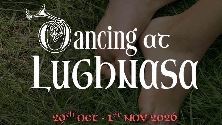 Feet in the grass with the title of the play in white writing