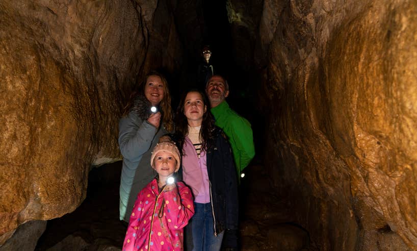 Family exploring a cave.