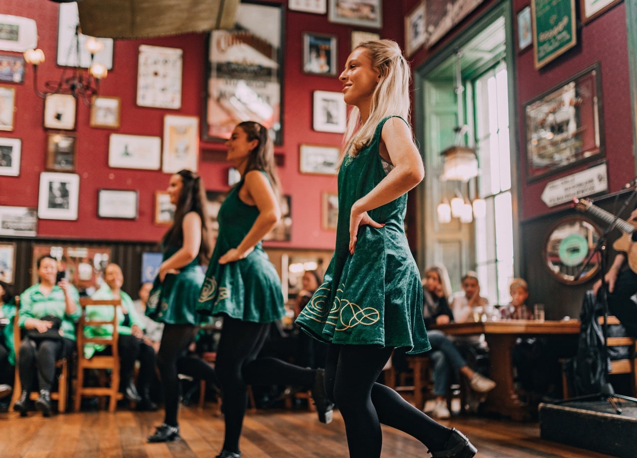 Three girls Irish dancing to an Irish jig at The Irish Dance Party Dublin