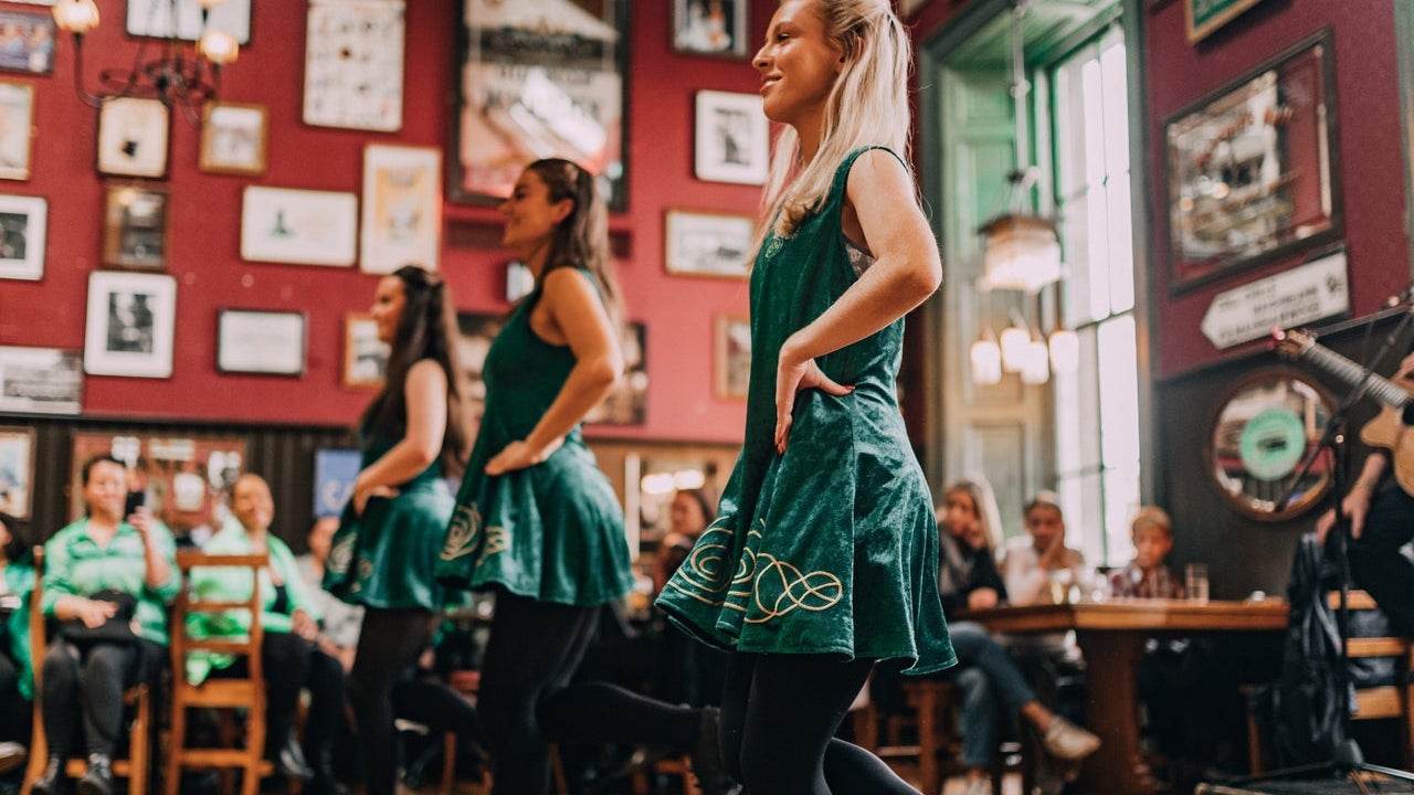 Three girls Irish dancing to an Irish jig at The Irish Dance Party Dublin