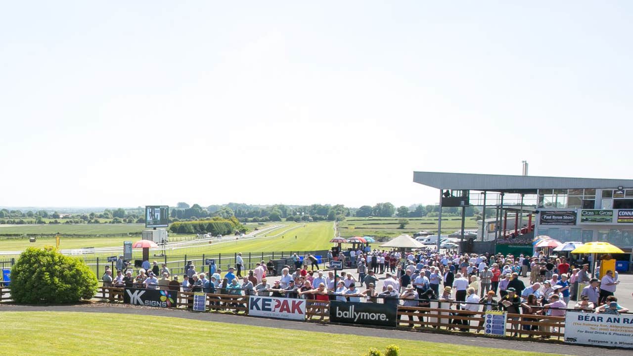 Race crowd by the grand stand