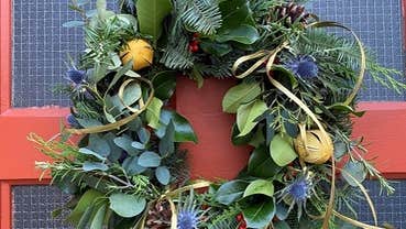 Festive Christmas wreath with red bow background.