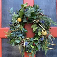 Festive Christmas wreath with red bow background.