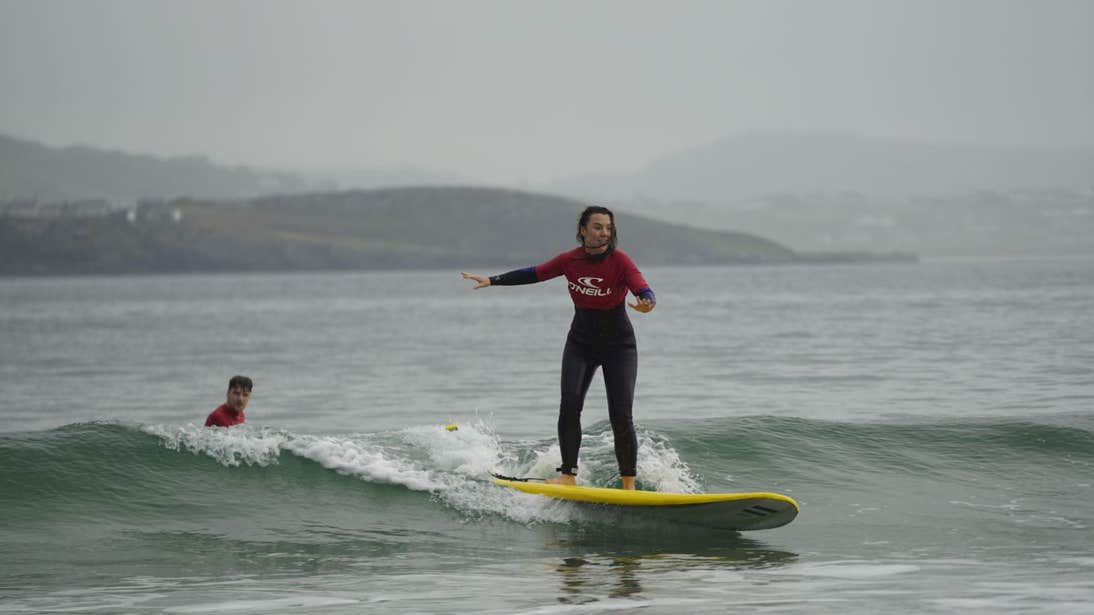 Sarah Hanrahan catching a wave with Narosa Surf School, Donegal