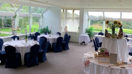 Function room with tables and flowers