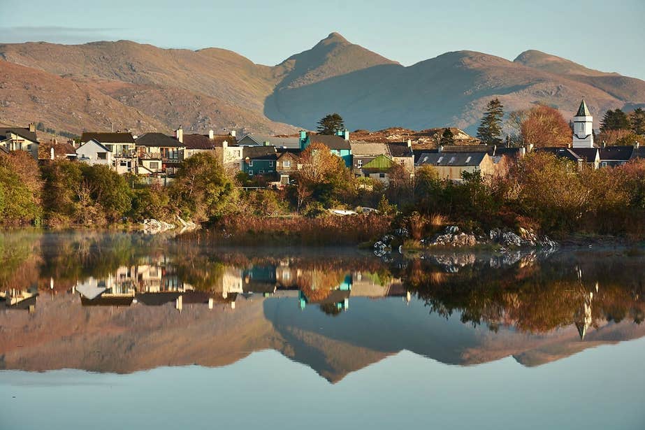 An image of houses and buildings reflected in the water at Sneem, Co. Kerry