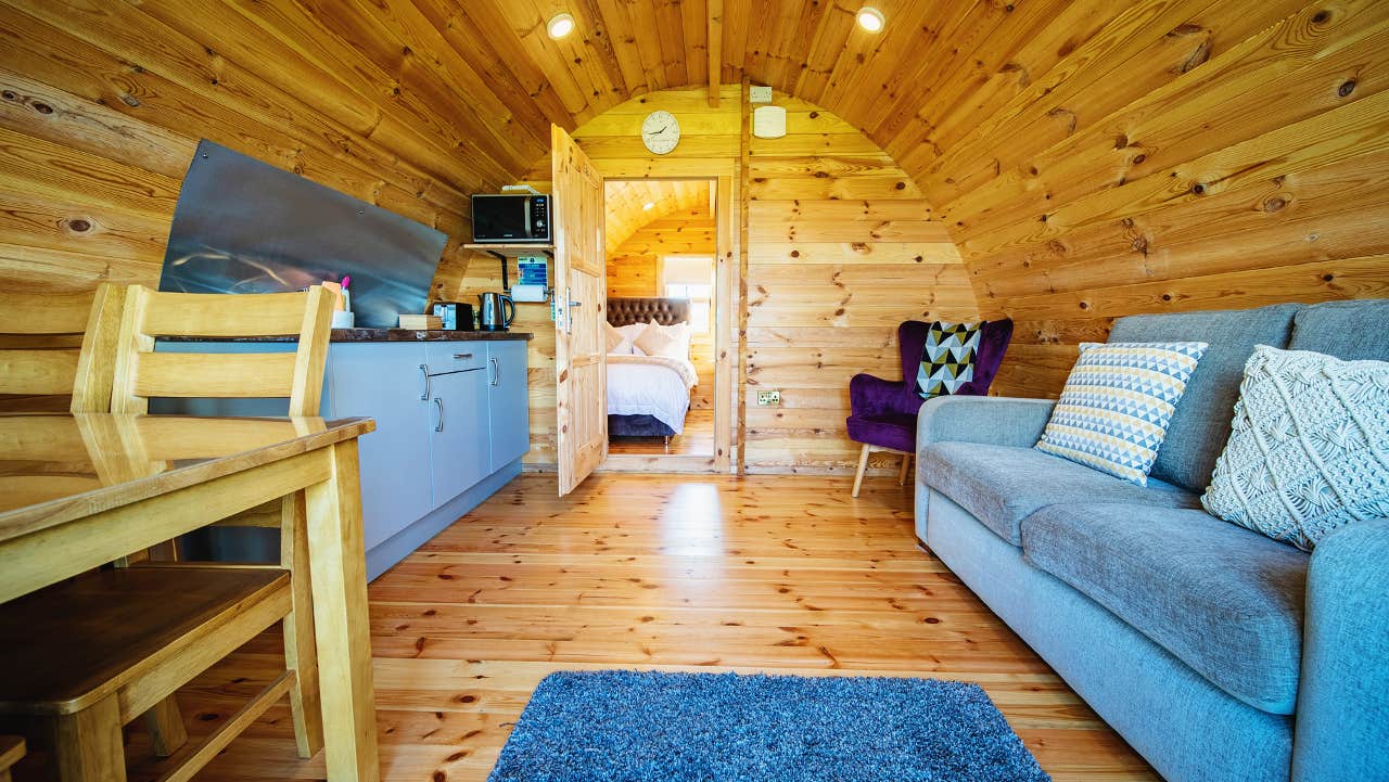 Inside view of pod with seating and kitchen area