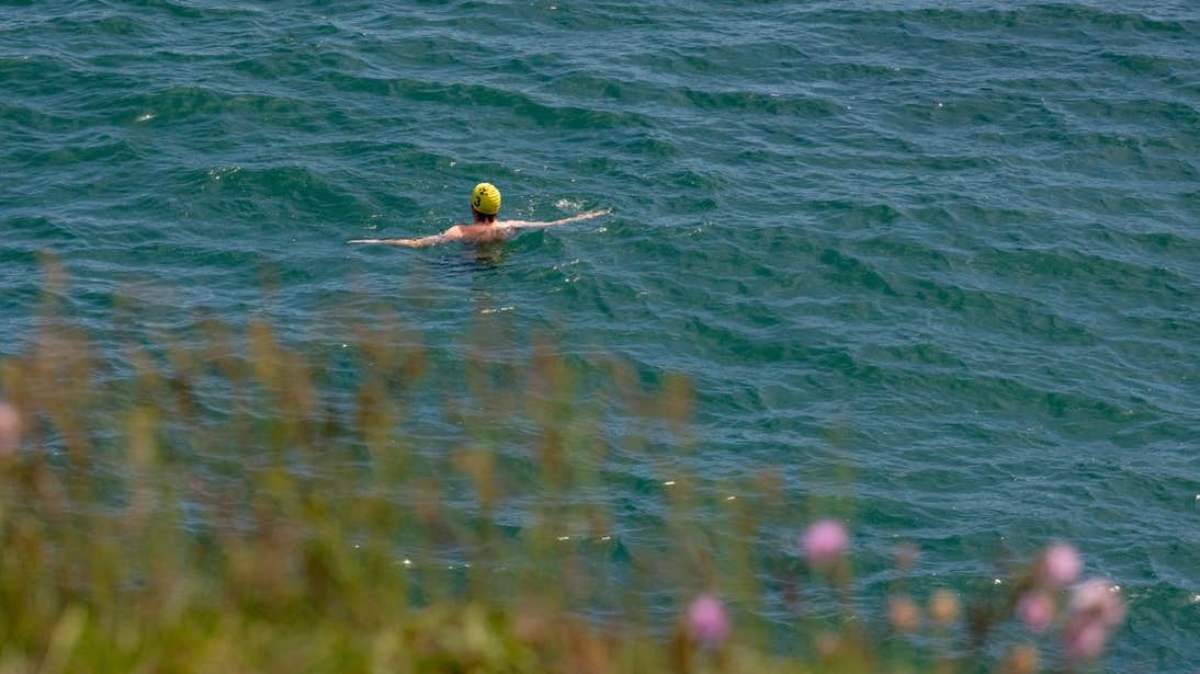 Person swimming in the sea at Brittas Bay in Wicklow