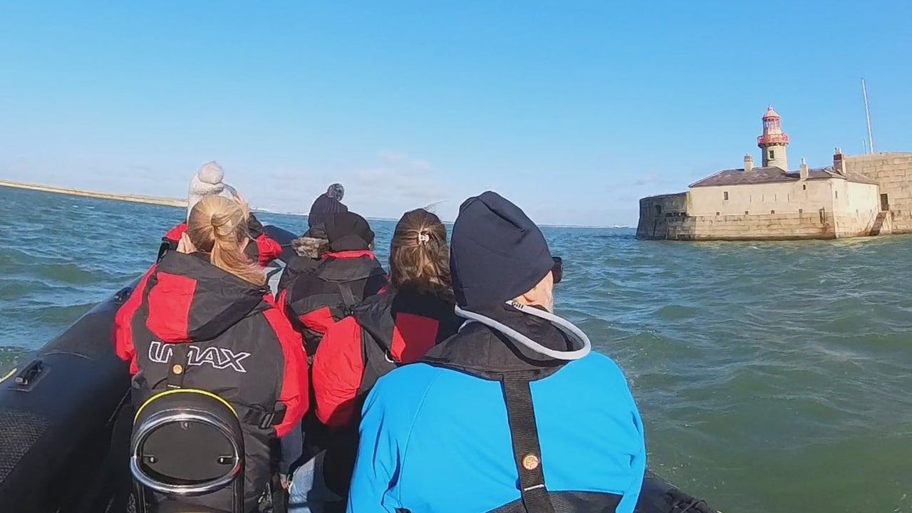 Passengers on a rib tour of a harbour