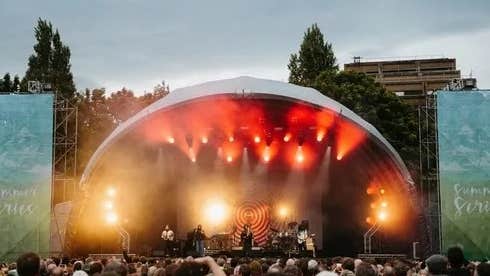 Trinity Summer Series 2026 - view of a dome shaped outdoor music stage with large audience