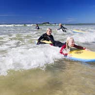 People taking surf lessons with Wild Atlantic Way Adventures in Co. Donegal