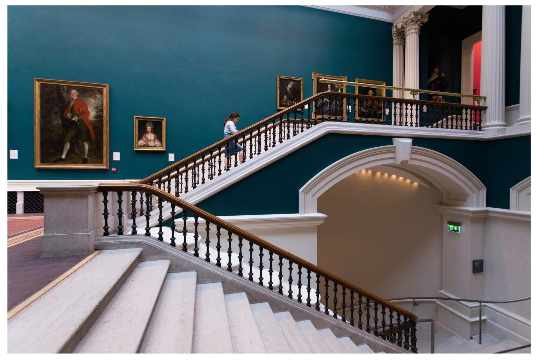 A woman walking up the stair in The National Gallery of Ireland
