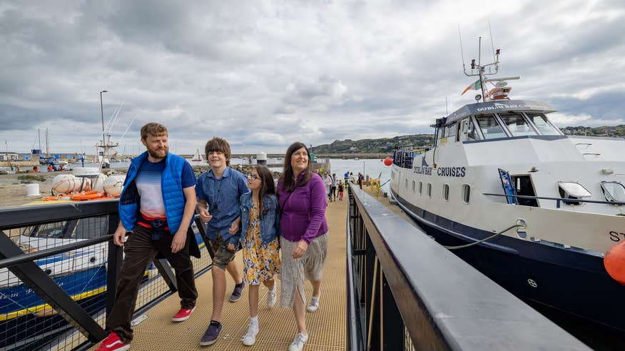A family disembarking from a Dublin Bay Cruise boat.