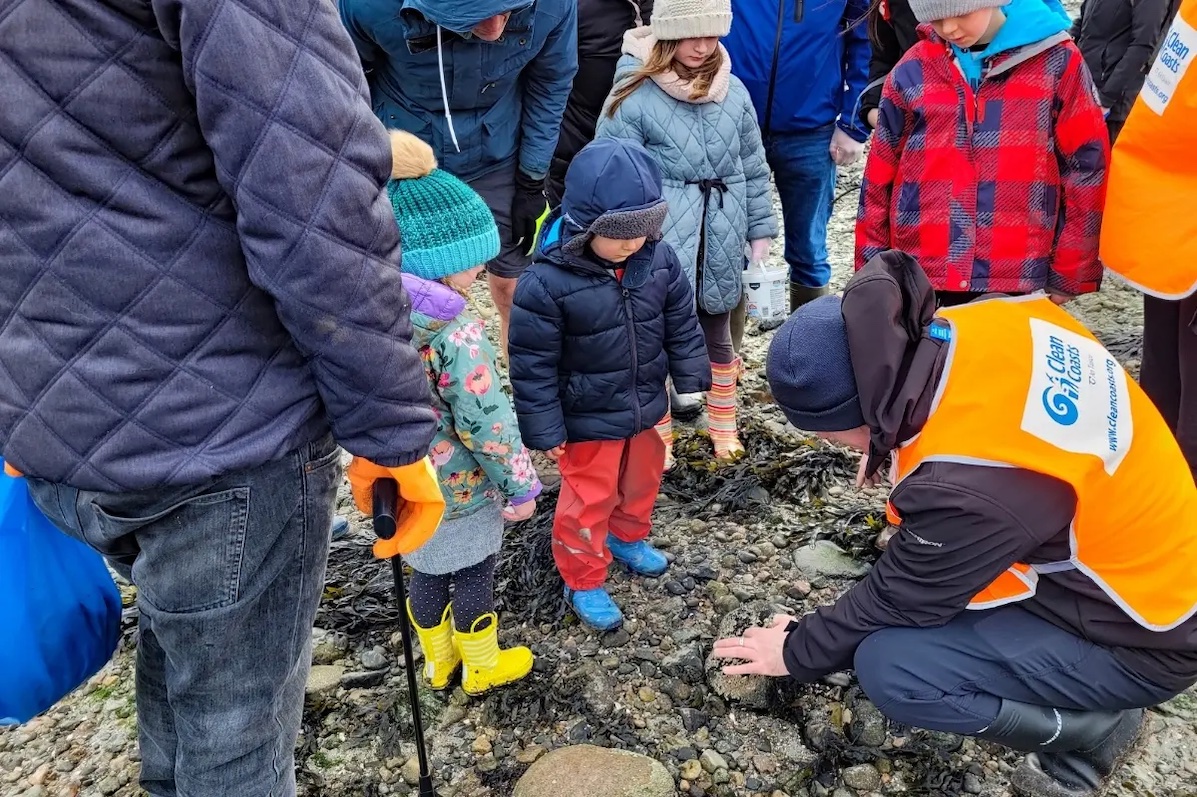 Galway Atlantaquaria with Explore Your Shore event, man digging in some rocks with children and adults looking on