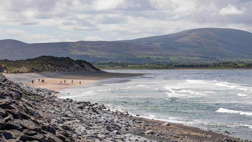 People walking on Strandhill Beach in County Sligo.