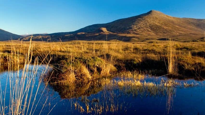 A reflection on the lake of the mountains within Ballycroy National Park