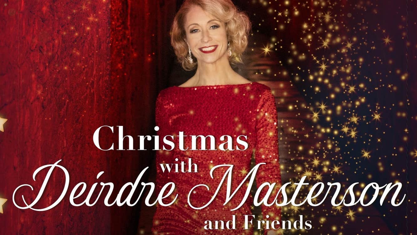 A smiling woman in glittery red evening dress with red and black background with lots of tiny gold lights