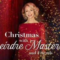 A smiling woman in glittery red evening dress with red and black background with lots of tiny gold lights