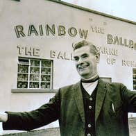 Rainbow Ballroom of Romance exterior and host in a black and white photo