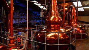 A copper still in a whiskey distillery