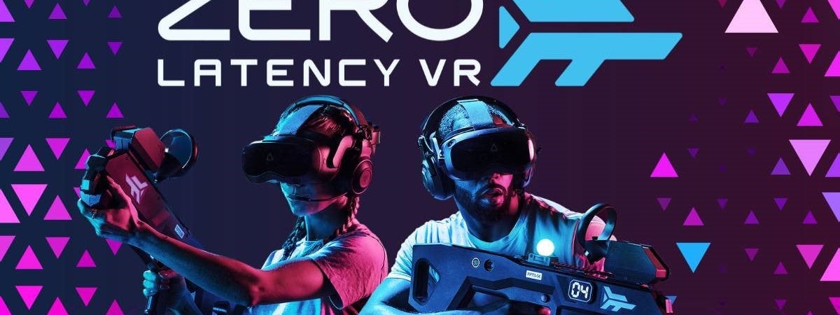 Two people using gaming equipment posing against a pink and purple background