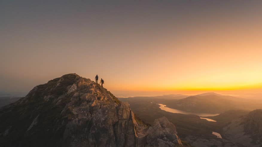 Hikers on Mount Errigal in Donegal at sunrise