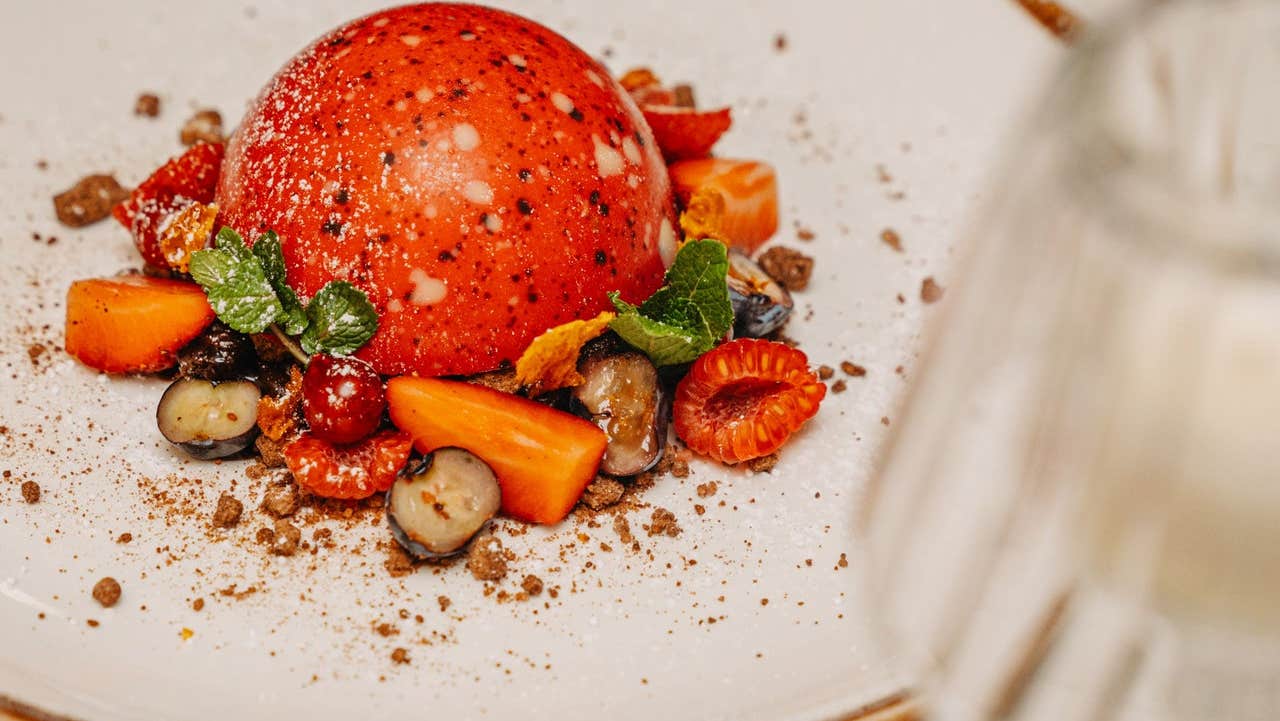 Chocolate dome dessert with fruit at cathedral restaurant