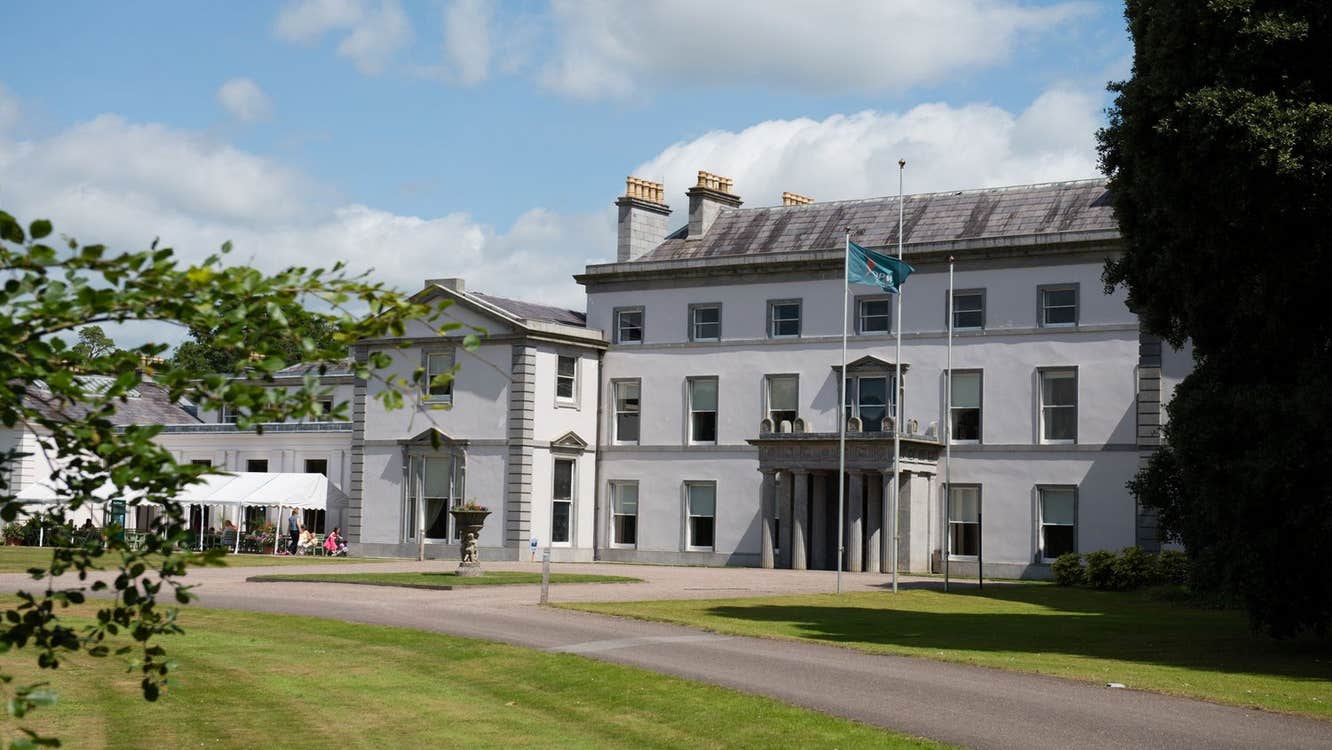 A large period house overlooking a well maintained lawn