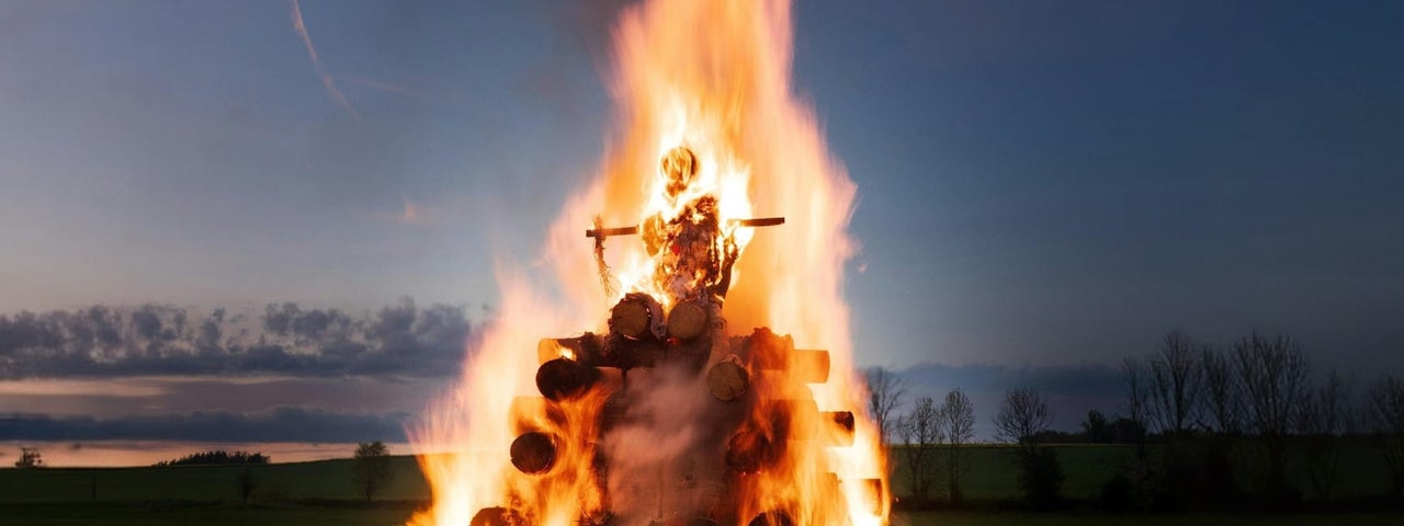 A bonfire burning at dusk