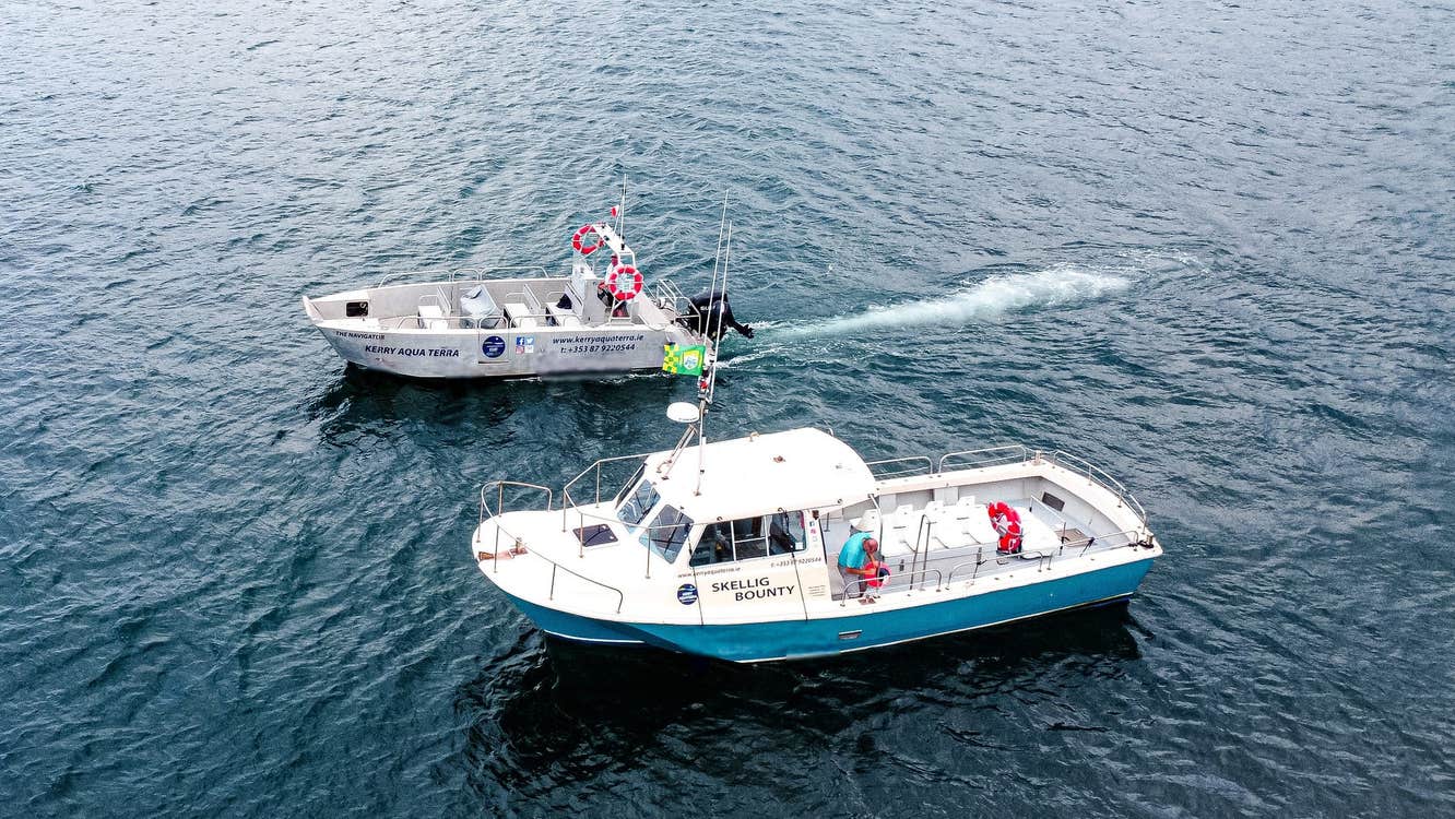 Two Kerry Aqua Terra boats sail beside each other at sea