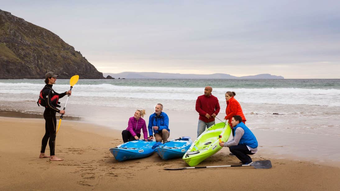 A group of people learning how to kayak in Dingle, Co. Kerry