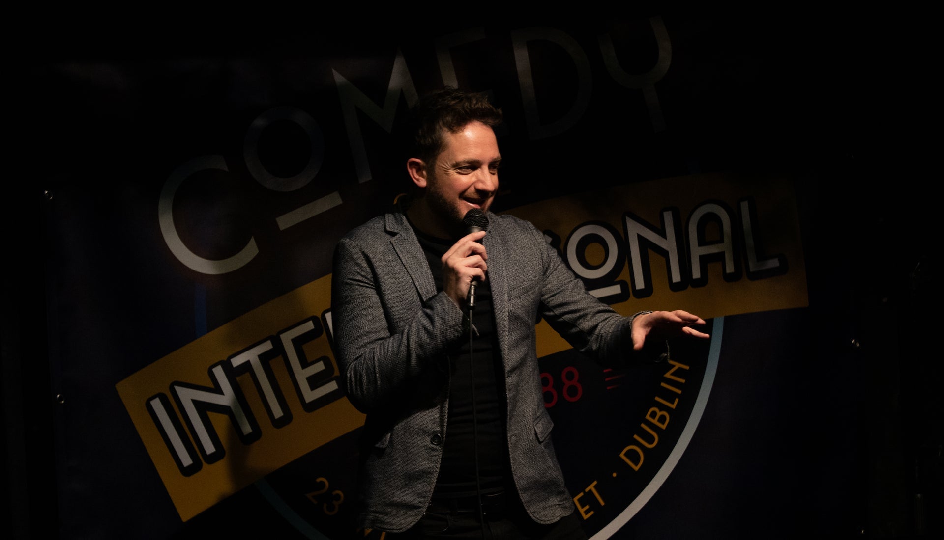 Stand up comedian on stage at Comedy at The International