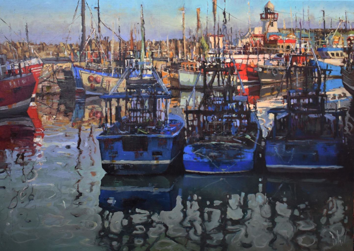 A row of boats at high tide in Balbriggan Harbour