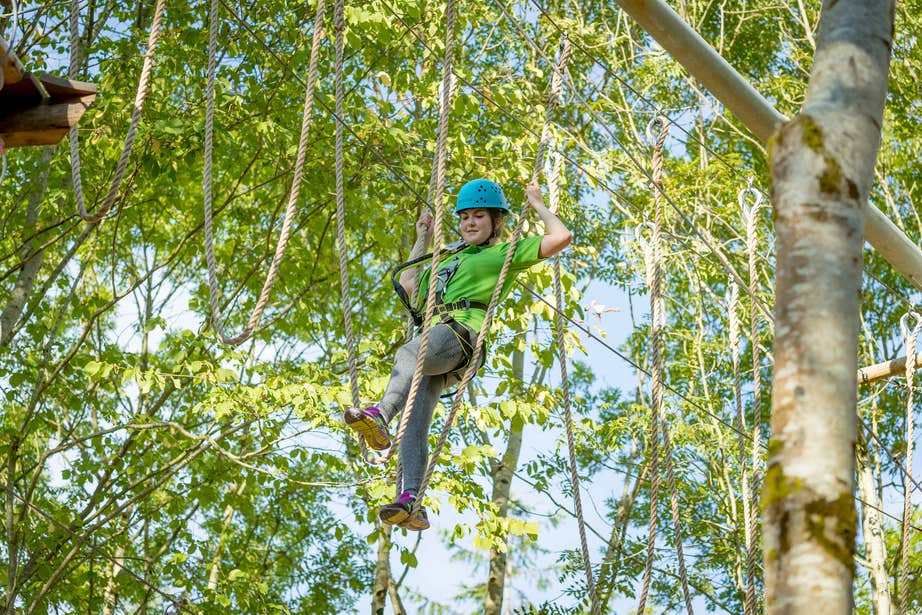 A woman on the tree top obstacle course at Castlecomber Discovery Park in County Kilkenny