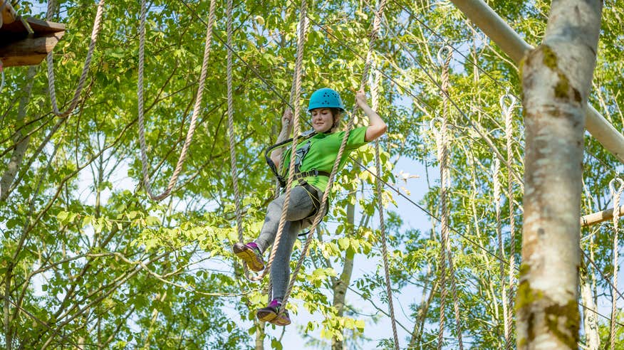 A woman on the tree top obstacle course at Castlecomber Discovery Park in County Kilkenny