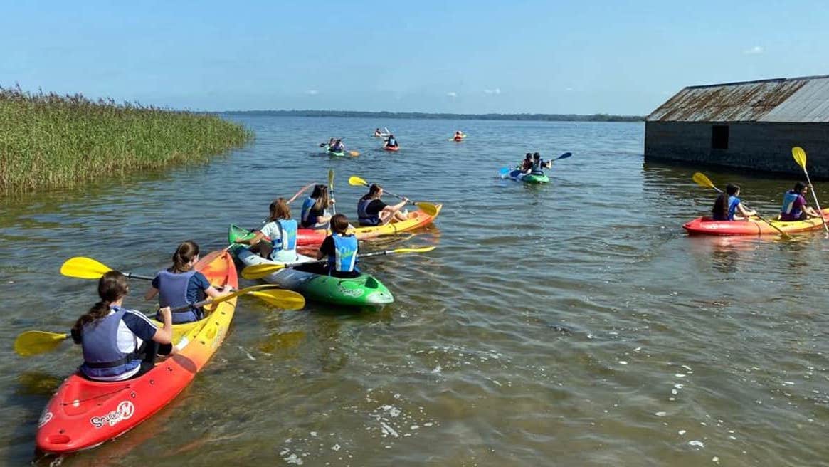 A group of girls canoeing at Lilliput Adventure Centre