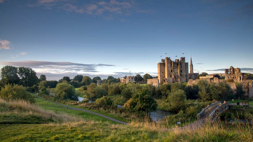Evening time in Trim with green hills around Trim Castle