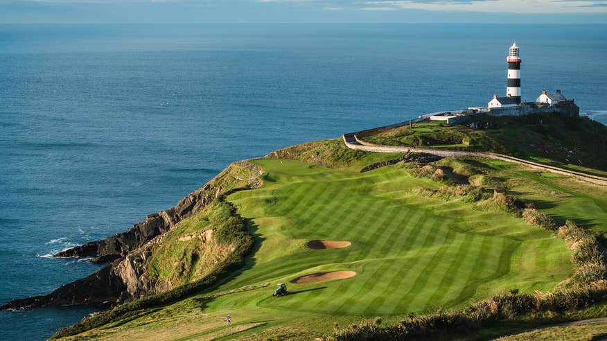 Aerial view of Old Head of Kinsale Golf Links and a lighthouse in County Cork